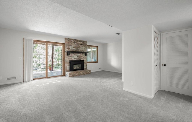 212 Eagle Lake Dr, Maple Grove, MN 55369 - unfurnished living room featuring carpet flooring, a brick fireplace, baseboards, and a textured ceiling