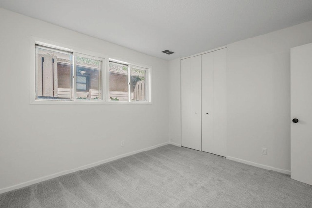 212 Eagle Lake Dr, Maple Grove, MN 55369 - unfurnished bedroom with carpet, baseboards, and a closet