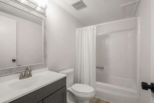 212 Eagle Lake Dr, Maple Grove, MN 55369 - bathroom with a textured ceiling, vanity, toilet, and shower / bath combo
