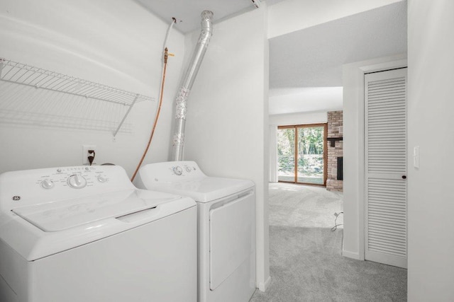 212 Eagle Lake Dr, Maple Grove, MN 55369 - washroom with washer and dryer, carpet flooring, and a brick fireplace