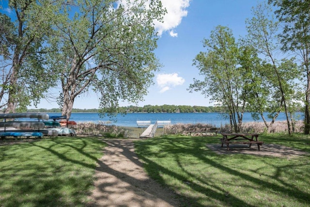 212 Eagle Lake Dr, Maple Grove, MN 55369 - view of grassy yard featuring a water view and a dock