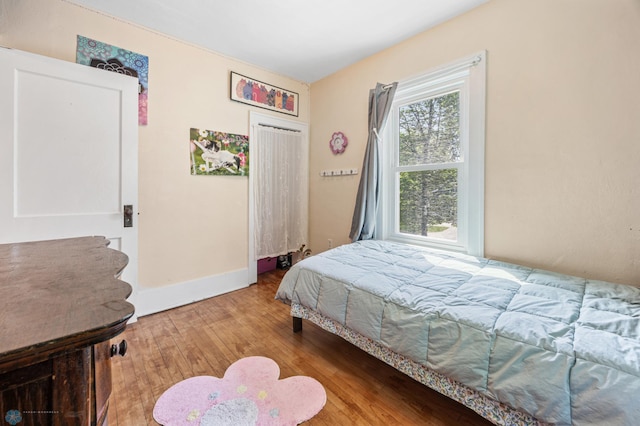 1413 11th Ave S, Fargo, ND 58103 - bedroom featuring wood-type flooring and baseboards