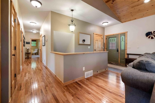 31172 Apache Cir, Breezy Point, MN 56472 - hallway with light wood-type flooring, lofted ceiling, baseboards, and wooden ceiling