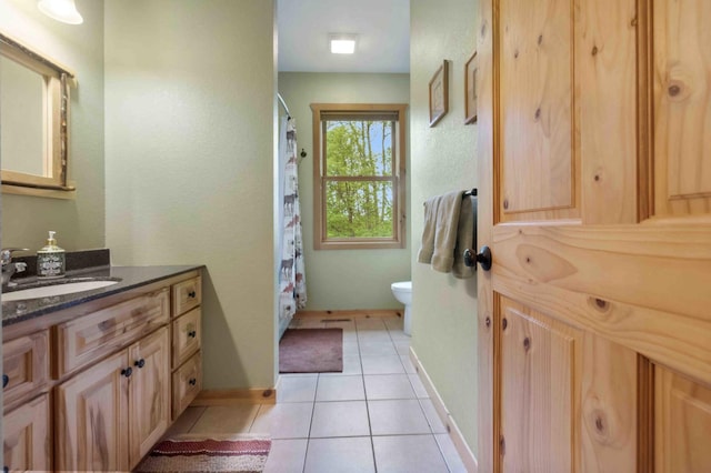 31172 Apache Cir, Breezy Point, MN 56472 - full bath featuring vanity, toilet, tile patterned flooring, baseboards, and a shower with curtain