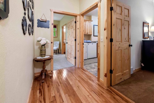 31172 Apache Cir, Breezy Point, MN 56472 - corridor with separate washer and dryer, light wood-style flooring, and baseboards