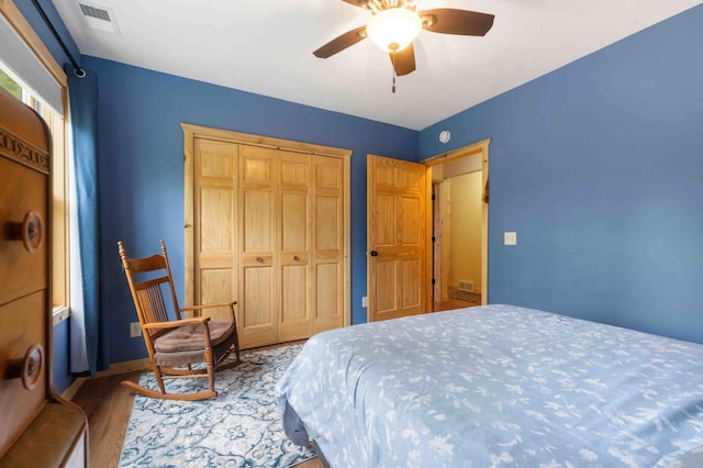 31172 Apache Cir, Breezy Point, MN 56472 - bedroom with wood finished floors, a closet, and ceiling fan
