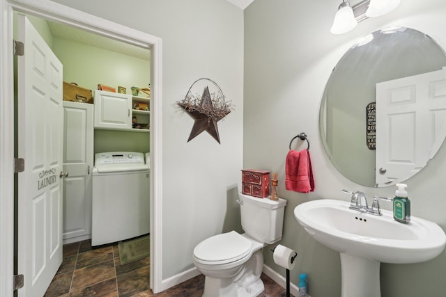 3157 Doneene Ln, Eagan, MN 55121 - half bathroom featuring washer / clothes dryer, stone finish flooring, toilet, and a sink