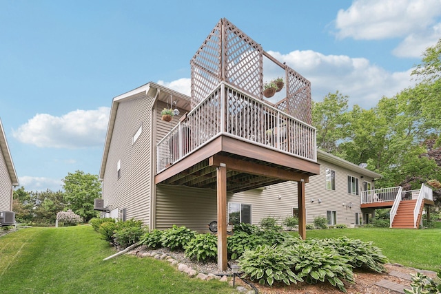 3157 Doneene Ln, Eagan, MN 55121 - rear view of house featuring a wooden deck, a lawn, and stairs