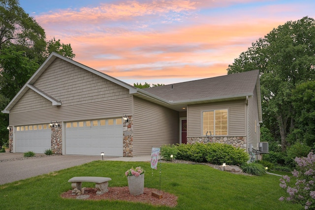 3157 Doneene Ln, Eagan, MN 55121 - view of front of property with stone siding, a yard, central air condition unit, a garage, and driveway