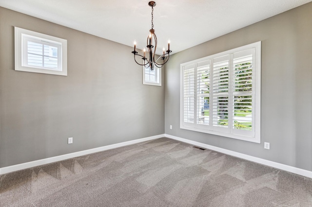 6005 Comstock Ln N, Plymouth, MN 55446 - empty room featuring plenty of natural light, a chandelier, and carpet flooring
