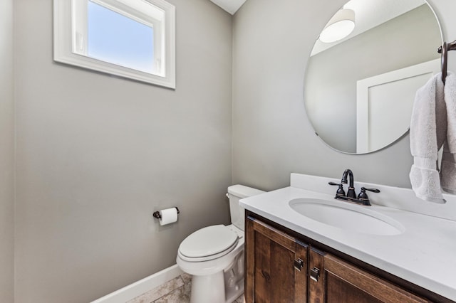 6005 Comstock Ln N, Plymouth, MN 55446 - bathroom featuring baseboards, vanity, toilet, and tile patterned flooring