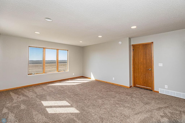 2717 88th Ave S, Fargo, ND 58104 - carpeted spare room with recessed lighting, baseboards, and a textured ceiling