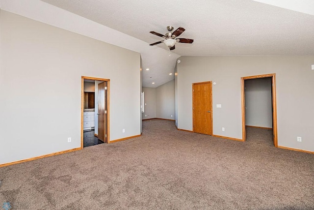 2717 88th Ave S, Fargo, ND 58104 - carpeted spare room featuring lofted ceiling, a ceiling fan, baseboards, and a textured ceiling
