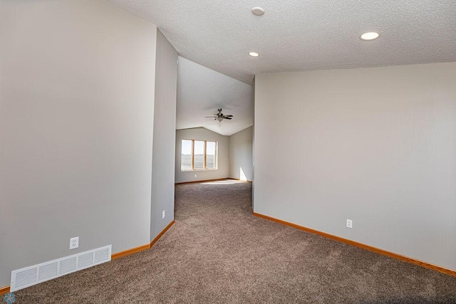 2717 88th Ave S, Fargo, ND 58104 - carpeted empty room with baseboards, lofted ceiling, recessed lighting, and a textured ceiling