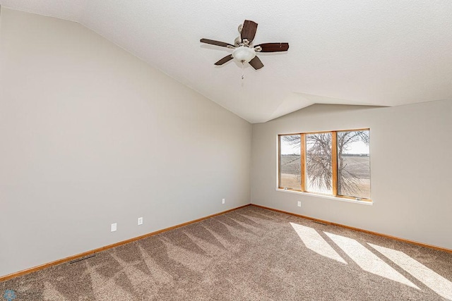 2717 88th Ave S, Fargo, ND 58104 - empty room featuring lofted ceiling, carpet floors, baseboards, and a ceiling fan