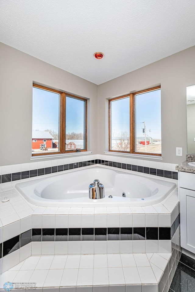 2717 88th Ave S, Fargo, ND 58104 - bathroom featuring vanity and a jetted tub