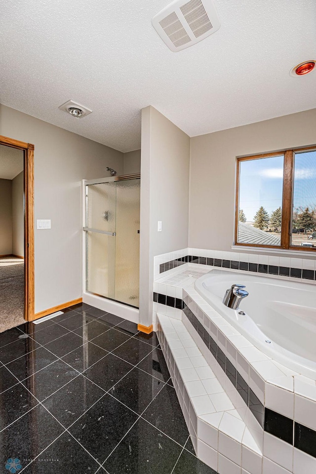 2717 88th Ave S, Fargo, ND 58104 - bathroom with baseboards, a stall shower, a garden tub, and granite tiled floors