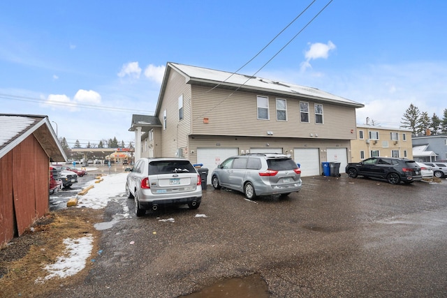 1599 Rice St, Saint Paul, MN 55117 - view of front of house featuring a garage and driveway