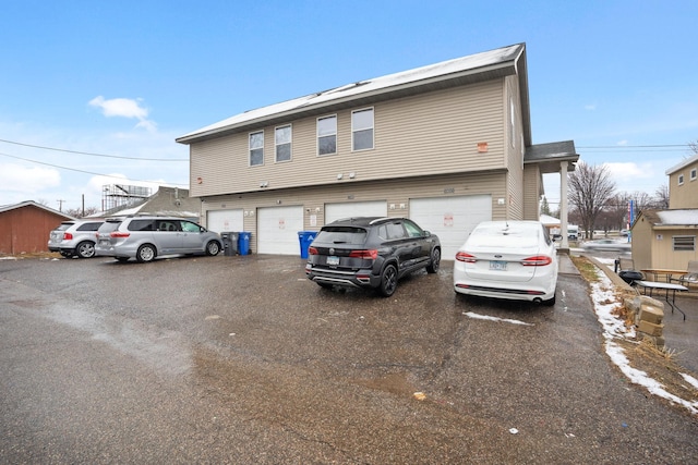 1599 Rice St, Saint Paul, MN 55117 - view of front of home with a garage and driveway