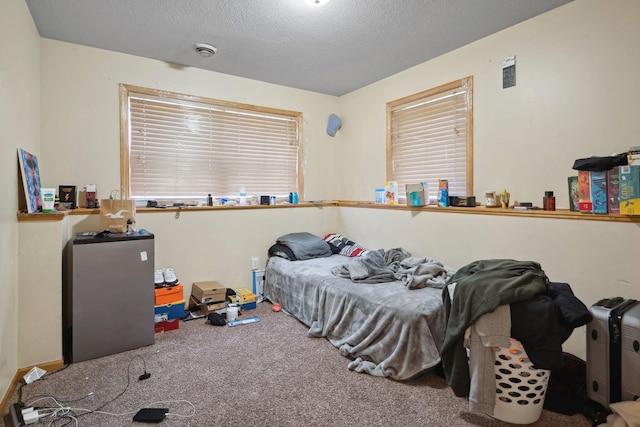 1599 Rice St, Saint Paul, MN 55117 - bedroom featuring carpet floors and a textured ceiling