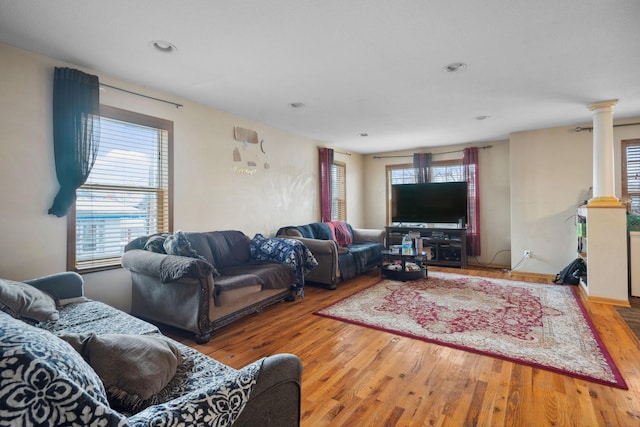 1599 Rice St, Saint Paul, MN 55117 - living room featuring ornate columns, wood finished floors, and recessed lighting
