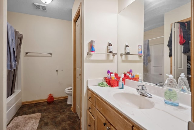 1599 Rice St, Saint Paul, MN 55117 - full bathroom with vanity, toilet, baseboards, and shower / tub combo