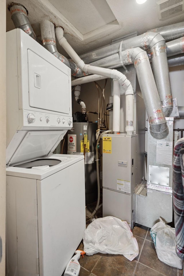 1599 Rice St, Saint Paul, MN 55117 - washroom with stacked washer / dryer and water heater