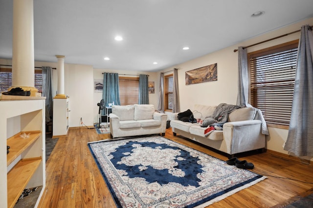 1599 Rice St, Saint Paul, MN 55117 - living area with wood finished floors, decorative columns, and recessed lighting