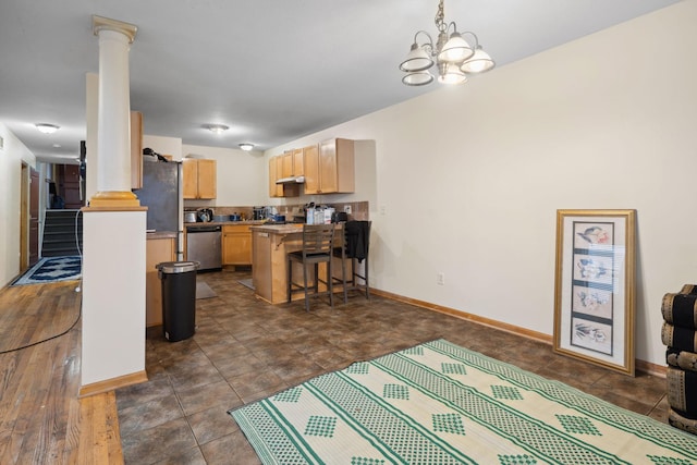 1599 Rice St, Saint Paul, MN 55117 - kitchen with appliances with stainless steel finishes, light brown cabinetry, a peninsula, ornate columns, and a breakfast bar area