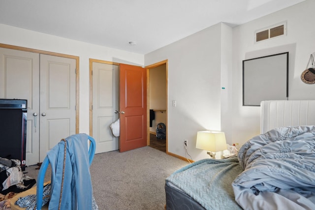 1599 Rice St, Saint Paul, MN 55117 - bedroom featuring carpet floors, a closet, and baseboards