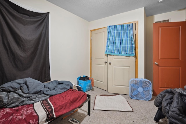 1599 Rice St, Saint Paul, MN 55117 - carpeted bedroom featuring a closet and a textured ceiling