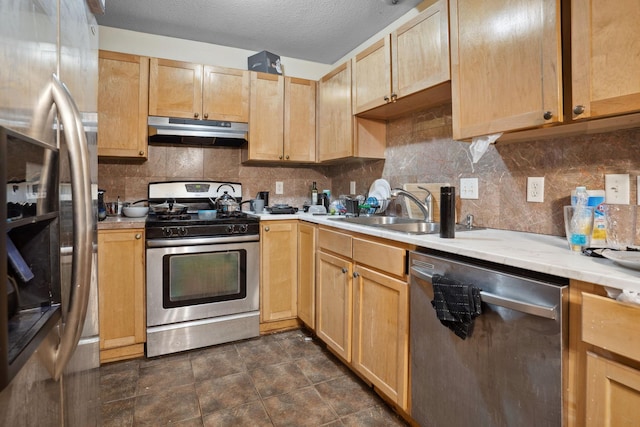 1599 Rice St, Saint Paul, MN 55117 - kitchen featuring stainless steel appliances, under cabinet range hood, a sink, light brown cabinetry, and a textured ceiling