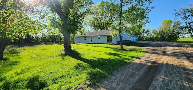 13386 Palomino Rd, Bertha Twp, MN 56437 - view of green lawn featuring concrete driveway and a garage