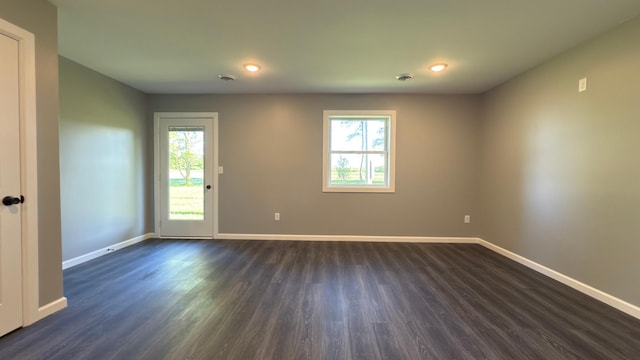 13386 Palomino Rd, Bertha Twp, MN 56437 - unfurnished room featuring plenty of natural light, dark wood-style flooring, baseboards, and recessed lighting