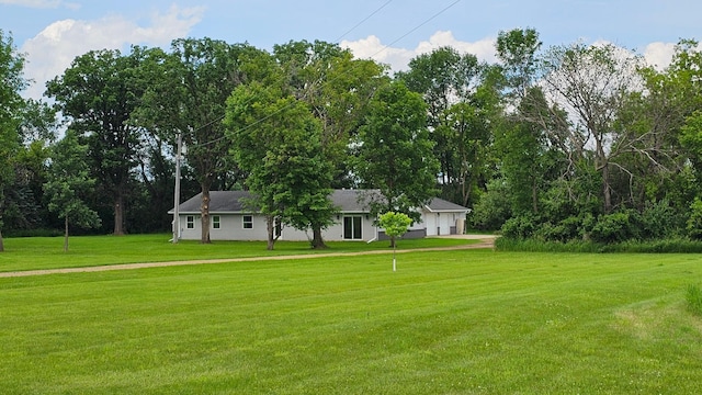 13386 Palomino Rd, Bertha Twp, MN 56437 - view of green lawn with an attached garage