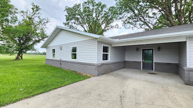 13386 Palomino Rd, Bertha Twp, MN 56437 - view of property exterior with a lawn, a patio, and a shingled roof