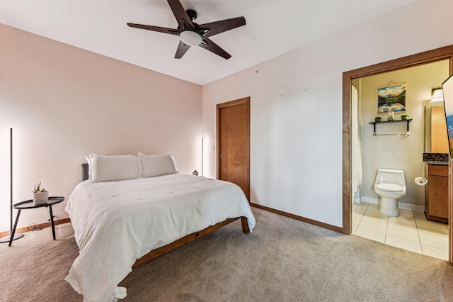 15 Franklin Ave Unit 312, Minneapolis, MN 55404 - bedroom with light colored carpet, baseboards, ensuite bath, and a ceiling fan