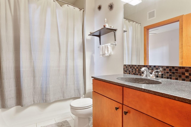 15 Franklin Ave Unit 312, Minneapolis, MN 55404 - full bathroom with backsplash, vanity, toilet, shower / bath combination with curtain, and tile patterned flooring