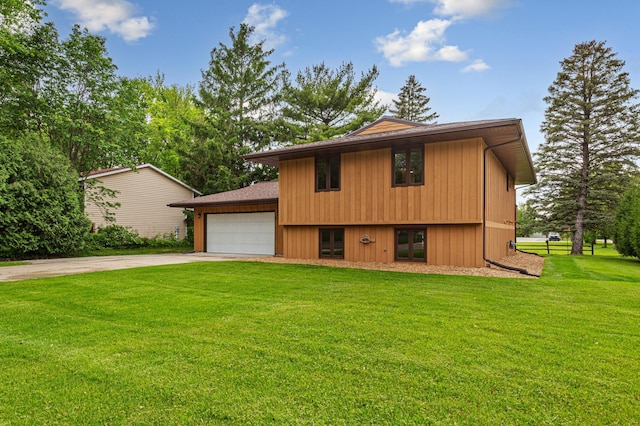 1930 6th Ave NE, Owatonna, MN 55060 - tri-level home with driveway, a front lawn, a garage, and french doors