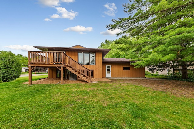 1930 6th Ave NE, Owatonna, MN 55060 - back of property with stairway, a deck, a yard, and central AC