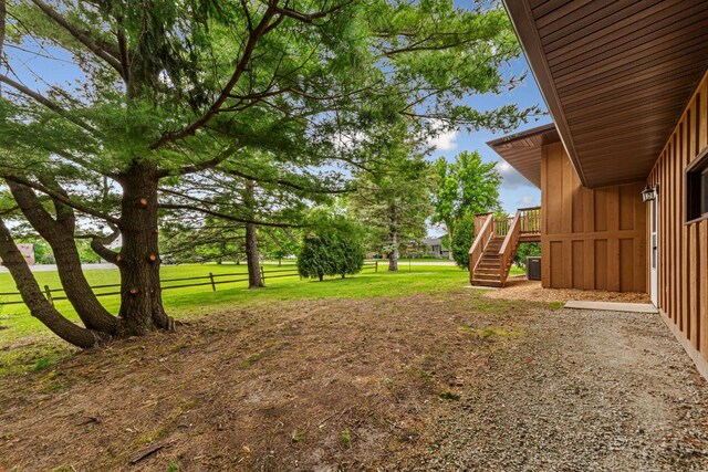 1930 6th Ave NE, Owatonna, MN 55060 - view of yard featuring stairway, a deck, and cooling unit