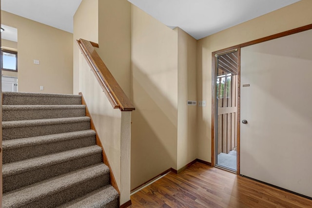 1930 6th Ave NE, Owatonna, MN 55060 - stairs with wood finished floors and healthy amount of natural light