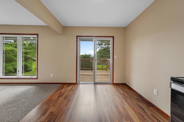 1930 6th Ave NE, Owatonna, MN 55060 - spare room with wood finished floors and baseboards