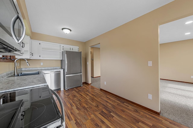 1930 6th Ave NE, Owatonna, MN 55060 - kitchen with appliances with stainless steel finishes, a sink, baseboards, white cabinets, and light countertops