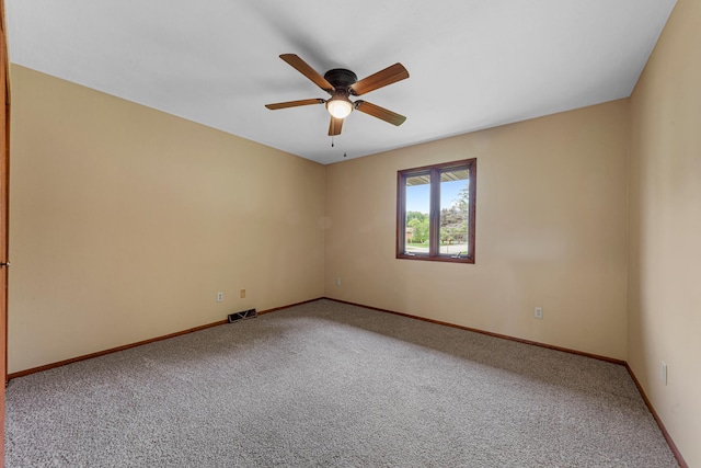 1930 6th Ave NE, Owatonna, MN 55060 - carpeted empty room featuring ceiling fan and baseboards