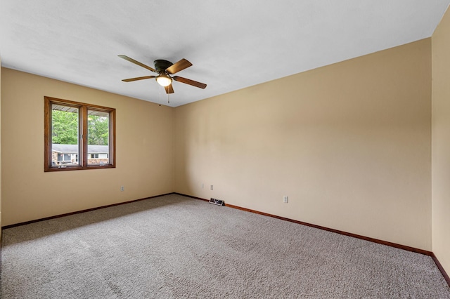 1930 6th Ave NE, Owatonna, MN 55060 - empty room featuring ceiling fan, baseboards, and carpet floors