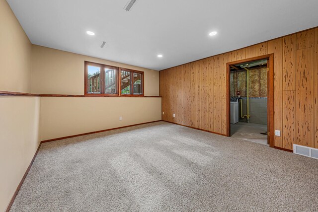 1930 6th Ave NE, Owatonna, MN 55060 - unfurnished room with baseboards, wood walls, carpet floors, and recessed lighting