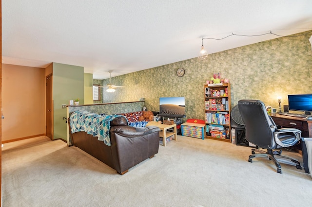 1351 4th St W, Hastings, MN 55033 - carpeted living area featuring a desk, wallpapered walls, baseboards, and ceiling fan