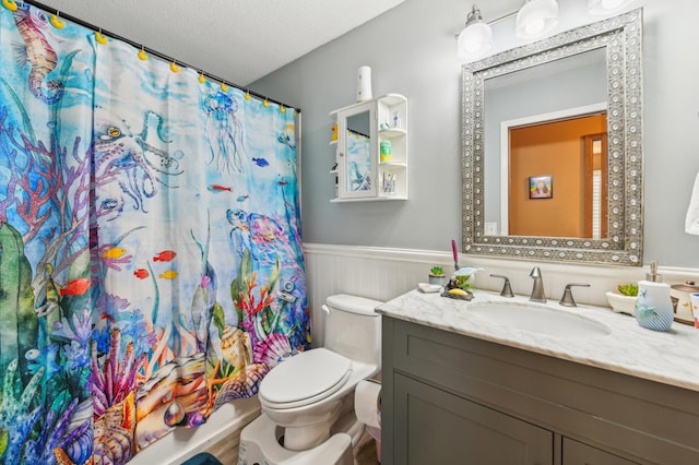 1351 4th St W, Hastings, MN 55033 - bathroom with vanity, toilet, wainscoting, a shower with shower curtain, and a textured ceiling