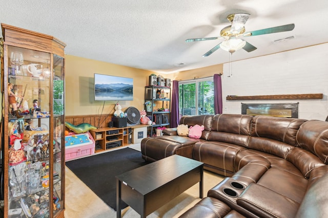 1351 4th St W, Hastings, MN 55033 - carpeted living area featuring ceiling fan, a textured ceiling, and wainscoting